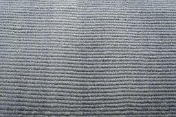 Backside of handmade New Modern Design rug showing knot structure and weave density