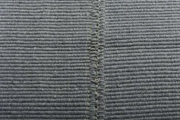 Backside of handmade New Modern Design rug showing knot structure and weave density