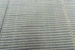 Backside of handmade New Modern Design rug showing knot structure and weave density