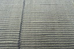 Backside of handmade New Modern Design rug showing knot structure and weave density
