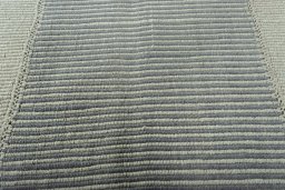 Backside of handmade New Modern Design rug showing knot structure and weave density