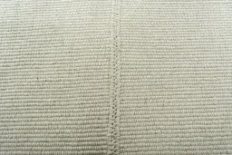 Backside of handmade New Modern Design rug showing knot structure and weave density