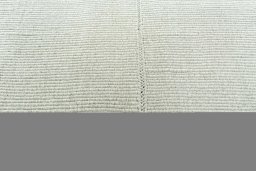Backside of handmade New Modern Design rug showing knot structure and weave density