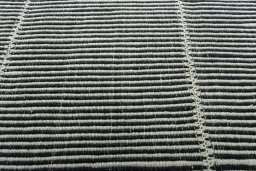 Backside of handmade New Modern Design rug showing knot structure and weave density