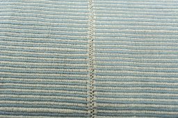 Backside of handmade New Modern Design rug showing knot structure and weave density