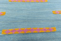 Backside of handmade New Modern Design rug showing knot structure and weave density