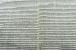 Backside of handmade New Modern Design rug showing knot structure and weave density