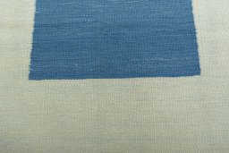 Backside of handmade New Modern Design rug showing knot structure and weave density