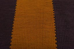 Backside of handmade New Modern Design rug showing knot structure and weave density