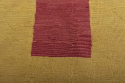 Backside of handmade New Modern Design rug showing knot structure and weave density