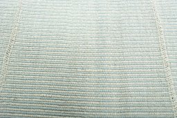 Backside of handmade New Modern Design rug showing knot structure and weave density