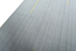 Backside of handmade New Modern Design rug showing knot structure and weave density