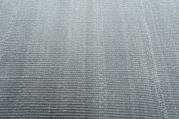 Backside of handmade New Modern Design rug showing knot structure and weave density
