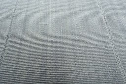Backside of handmade New Modern Design rug showing knot structure and weave density