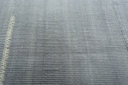Backside of handmade New Modern Design rug showing knot structure and weave density