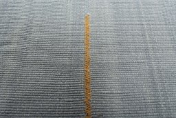 Backside of handmade New Modern Design rug showing knot structure and weave density