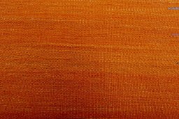 Backside of handmade New Modern Design rug showing knot structure and weave density