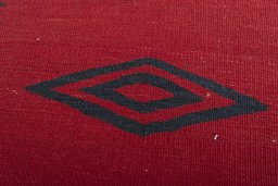 Backside of handmade New Modern Design rug showing knot structure and weave density
