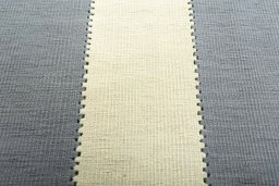 Backside of handmade New Modern Design rug showing knot structure and weave density