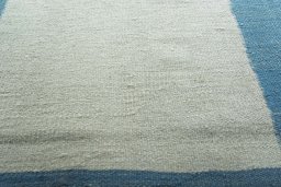 Backside of handmade New Modern Design rug showing knot structure and weave density