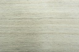 Backside of handmade New Modern Design rug showing knot structure and weave density