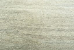 Backside of handmade New Modern Design rug showing knot structure and weave density