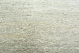 Backside of handmade New Modern Design rug showing knot structure and weave density
