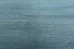 Backside of handmade New Modern Design rug showing knot structure and weave density