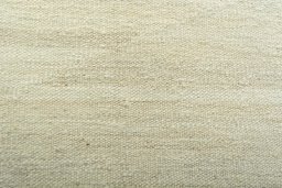 Backside of handmade New Modern Design rug showing knot structure and weave density