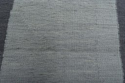 Backside of handmade New Modern Design rug showing knot structure and weave density