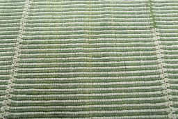 Backside of handmade New Modern Design rug showing knot structure and weave density