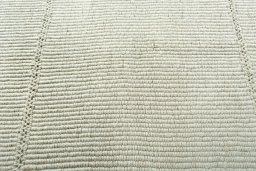 Backside of handmade New Modern Design rug showing knot structure and weave density