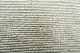 Backside of handmade New Modern Design rug showing knot structure and weave density