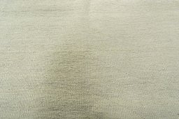 Backside of handmade New Modern Design rug showing knot structure and weave density