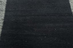 Backside of handmade New Modern Design rug showing knot structure and weave density