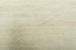 Backside of handmade New Modern Design rug showing knot structure and weave density