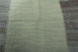 Backside of handmade New Modern Design rug showing knot structure and weave density