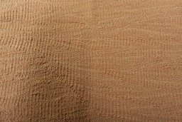 Backside of handmade New Modern Design rug showing knot structure and weave density