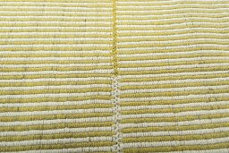 Backside of handmade New Modern Design rug showing knot structure and weave density