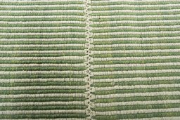 Backside of handmade New Modern Design rug showing knot structure and weave density