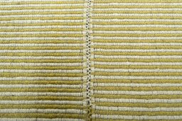 Backside of handmade New Modern Design rug showing knot structure and weave density
