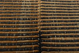 Backside of handmade New Modern Design rug showing knot structure and weave density