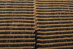 Backside of handmade New Modern Design rug showing knot structure and weave density