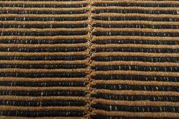 Backside of handmade New Modern Design rug showing knot structure and weave density