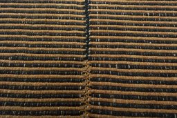Backside of handmade New Modern Design rug showing knot structure and weave density