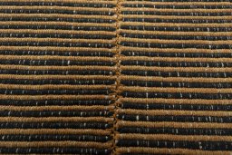 Backside of handmade New Modern Design rug showing knot structure and weave density