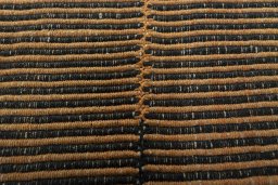 Backside of handmade New Modern Design rug showing knot structure and weave density