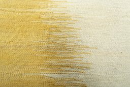 Backside of handmade New Modern Design rug showing knot structure and weave density