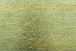 Backside of handmade New Modern Design rug showing knot structure and weave density