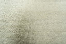 Backside of handmade New Modern Design rug showing knot structure and weave density